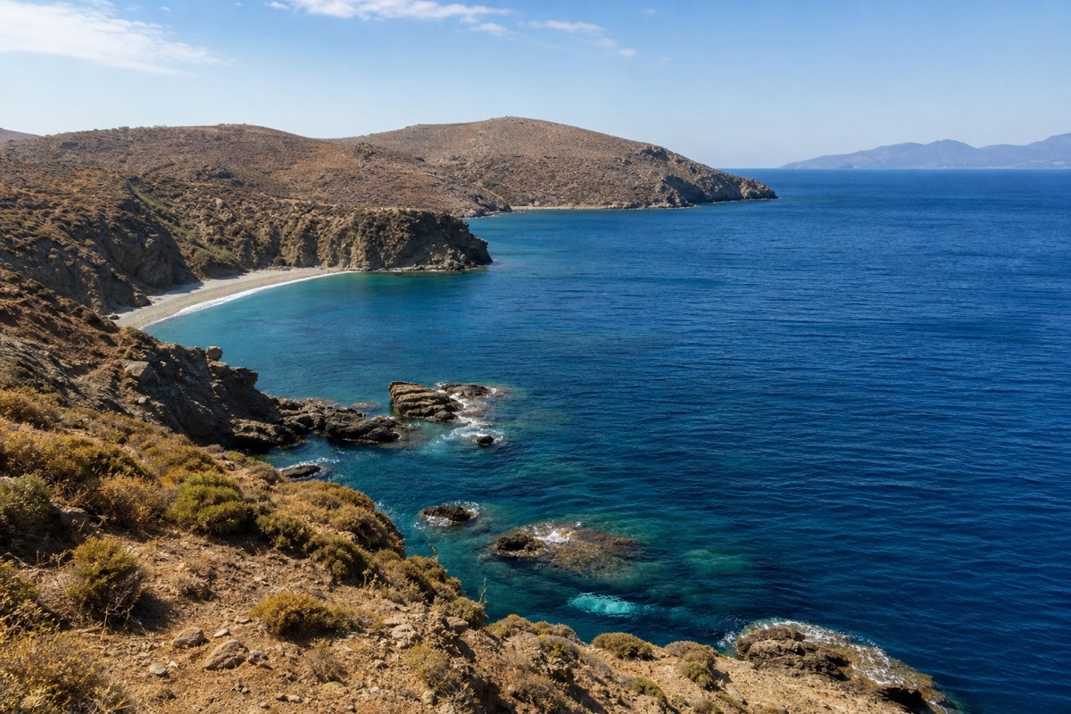 Rugged Aegean coastline along the Greek islands to avoid, with mainland hills in the distance