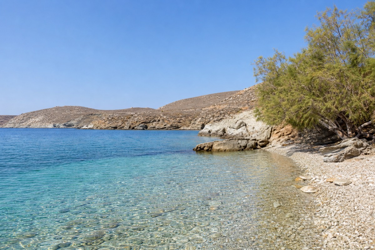 A Cycladic beach cove on a Greek island, when to visit the Greek islands for warm water