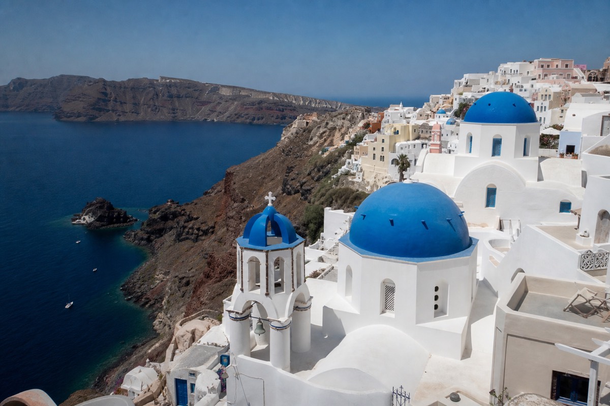 Santorini's famous blue domes overlooking the volcanic caldera